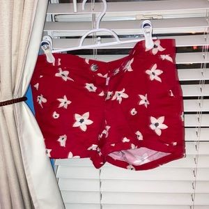 Low rise floral red shorts.